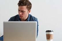 a man sitting behind a computer
