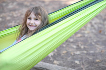 smiling girl in a hammock 