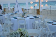 A reception on the beach at sunset 