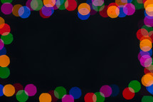 colored bokeh holiday lights background.