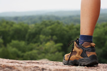 hiking boots on a mountaintop