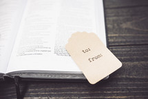 gift tag on an open Bible 