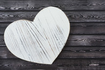 wood heart shape on wood background 