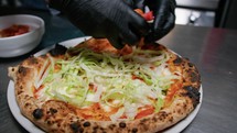 Pizza Chef Adding Tomatoes And Salad