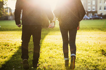 walking through the park holding hands