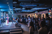 worship leaders on stage at a worship service 