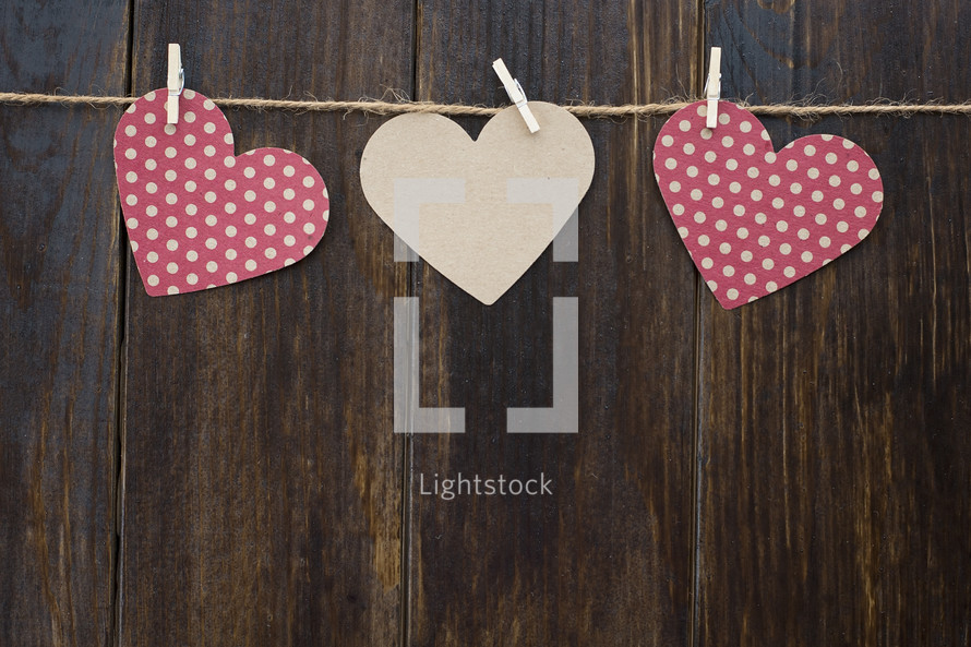paper hearts hanging on twine for Valentines day 