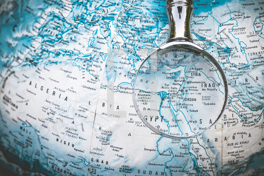 magnifying glass on a globe 
