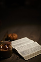 Open BIble by candlelight