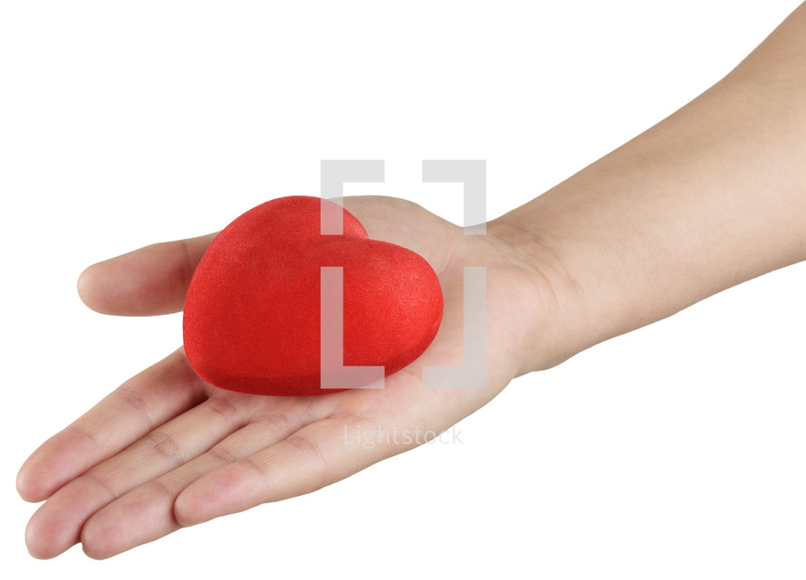 hand holding a red heart 