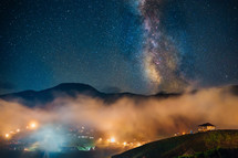 Milky Way galaxy and foggy night in the mountain village