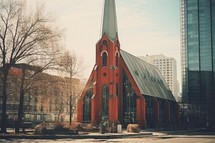 Vintage retro hipster style image of a church in the city