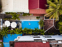 aerial view over a person swimming in a pool 