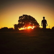 Man outdoors at sunset