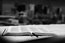 A Bible sits at the edge of a building overlooking downtown Dallas.