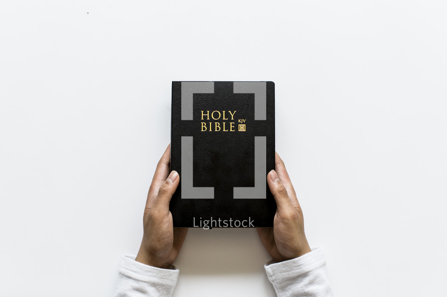 hands holding a Bible 