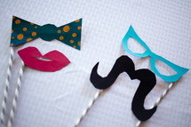 Lips, mustache, bow tie and glasses party favors.