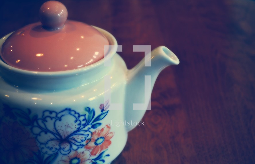 tea pot on a wood table 