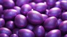 Glossy purple Easter eggs background texture.
