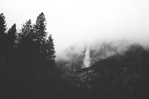 waterfall and fog on a mountain 
