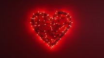 Heart. made up of christmas lights on a red background. 