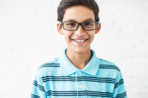 smiling boy child with glasses 