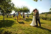 bride and groom and couples kissing