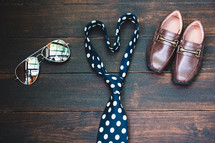 sunglasses, necktie, and dress shoes 