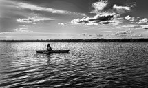 on a kayak in black and white 