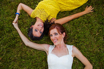 sisters lying the grass