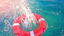 life saving buoy. Floating rescue buoy on the water surface. Safety equipment, Swimming pool.
