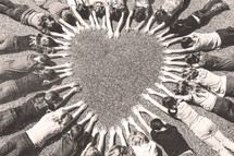 kids forming a heart shape with their hands 