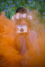 a girl holding a camera 