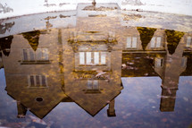 reflection of a house in water 