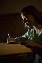 girl studying from an opened book