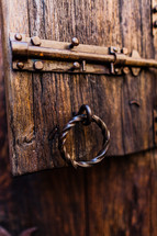 Old fashioned  lock on door metal steel iron old wood castle door heavy
