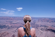 a woman looking out at a canyon view 
