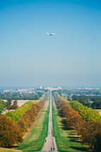 plane flying over an autumn  park 