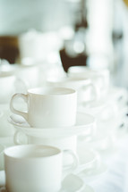 white coffee cups and saucers 