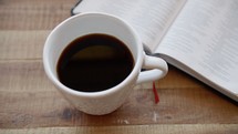 black coffee and opened Bible 