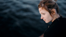 side profile of a young woman on a ferry 