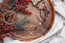 rosary in a wooden tray at Christmas 