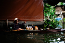 elderly woman in a canoe