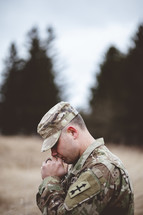 soldier with praying hands 