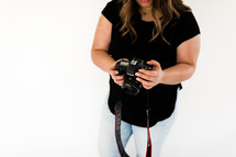 woman holding a camera 