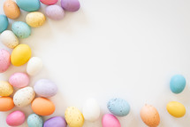 Border of easter eggs on a white background