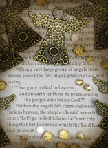 Close-up scripture with angels and jewels. Luke 2:13-15
