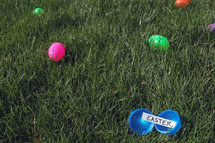Plastic Easter egg open on grass
