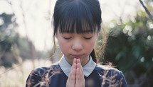 Asian Girl in a Praying Position
