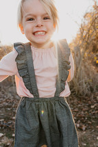smiling little girl outdoors 